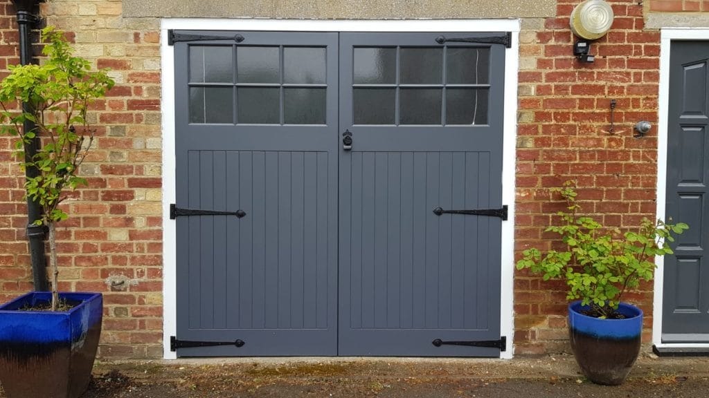 Carriage House Style Garage Door - Estate Series with Black Forged Iron Hardware