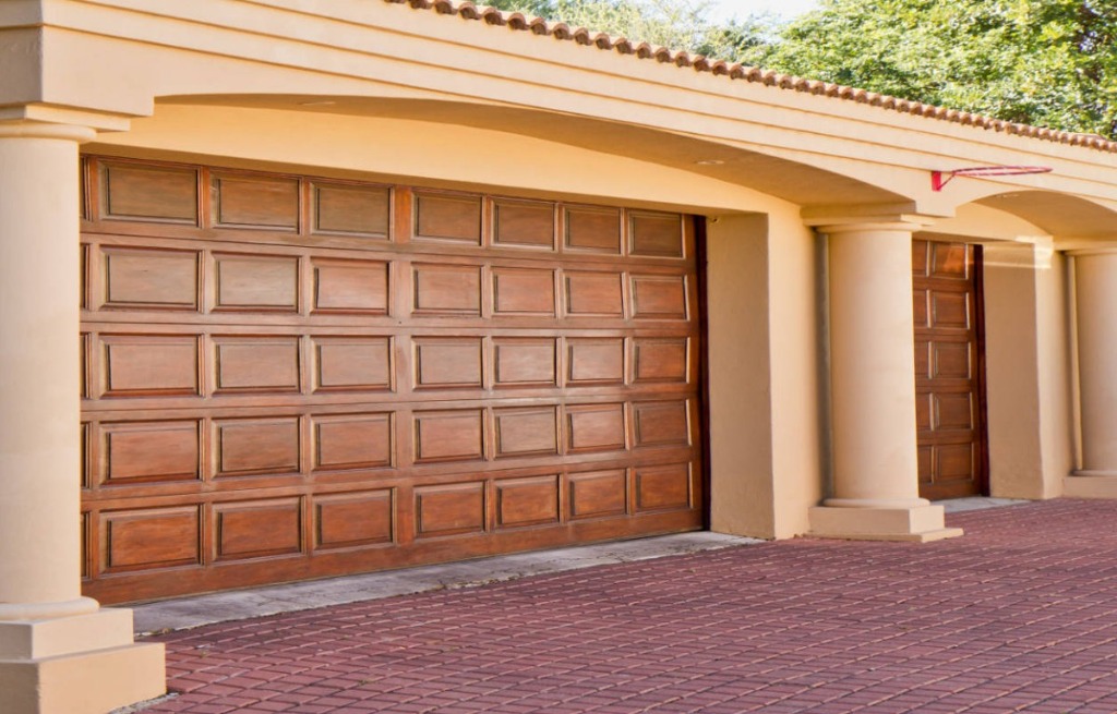 Wood Raised Panel Garage Door - Tuscan Villa Luxury Multi-Bay Architecture